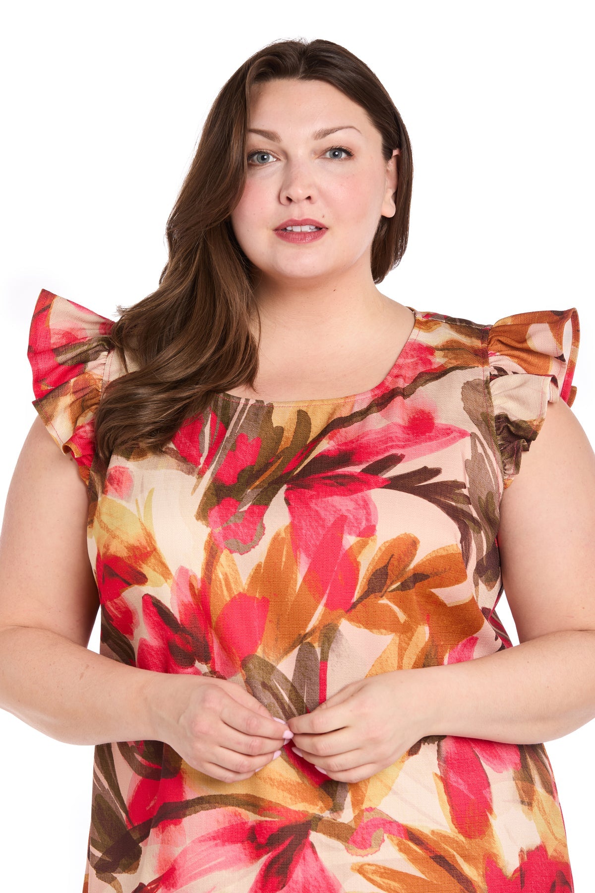 A woman with long brown hair models the Plus-Size Floral Party Dress: R&M Richards 4105W, a knee-length ruffle dress with a floral pattern, standing against a plain white background.